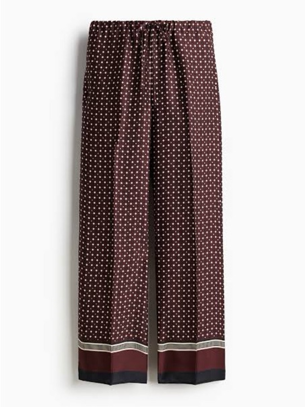 Burgundy wide-leg satin trousers with a geometric print and stripe hem